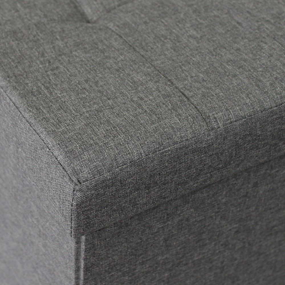 Pouf contenitore rettangolare in tessuto grigio scuro con dimensioni 76x38xH38 cm